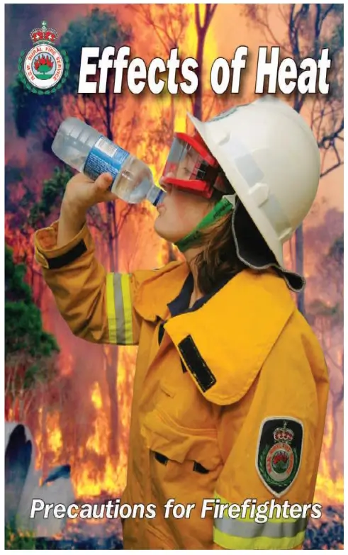 Firefighter drinking from bottle in front of bushfire